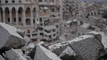 Ruins of buildings, concrete debris, damaged architecture, urban destruction, architectural remnants, cityscape.