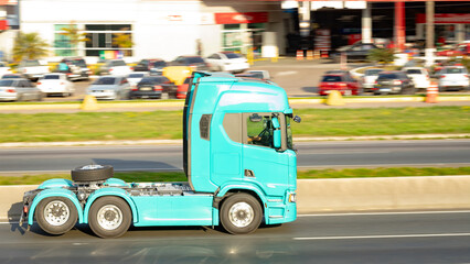 Bold and Bare: Turquoise Truck Cab on the Move
