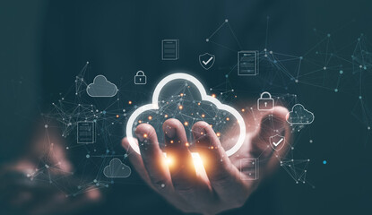 Cloud computing concept. Businessman hand holding a glowing cloud icon surrounded by network connections and security symbols. Representing data storage, cloud services and digital infrastructure.