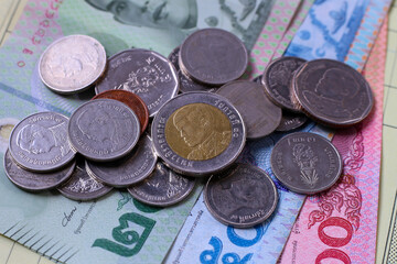 Banknotes with coins of the Thai baht money