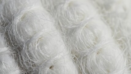 Tangled threads create soft swirling mass - Powered by Adobe