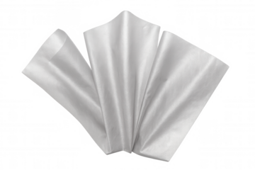 Rectangular tissues fanning out, layered translucently against neutral white backdrop