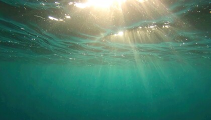 Underwater Sunlight Rays in Teal Ocean