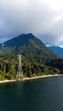 Mountain lake view with power lines