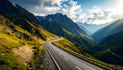 Naklejka premium Winding road leads through mountainous landscape under a cloudy sky