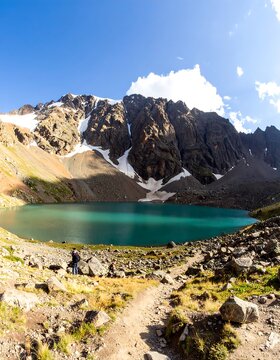 Mountain lake with hikers