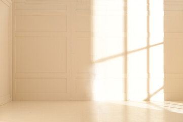 empty light wall and floor with light and shadow from windows