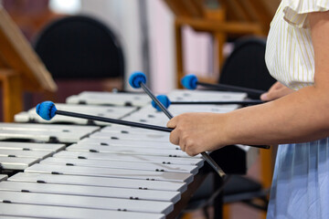 Hands of a girl playing the vibraphone
