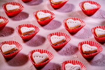Heart cookies on red fabric