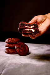 Hand holding cookie close up