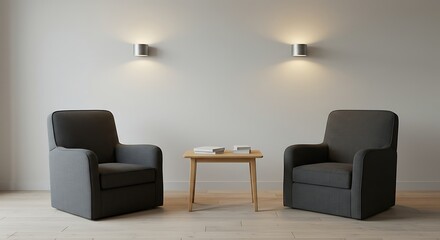 A minimalist living room scene featuring two comfortable grey armchairs facing each other across a small wooden coffee table