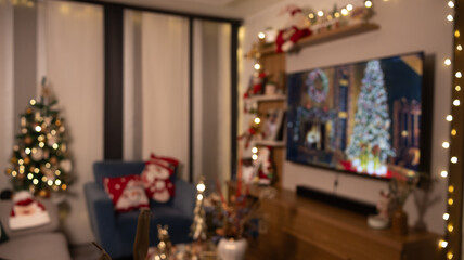 Blurred Christmas living room with lights, tree and holiday decor. Cozy festive background with warm atmosphere. Perfect bokeh for seasonal design and holiday projects.
