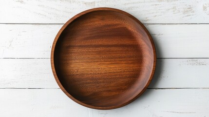 A dark wooden bowl sits on a white painted wooden plank surface. It can be used for food photography and culinary presentation.