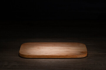 board Brown wooden floor in night atmosphere, dark background, light reflection on the floor, suitable for creating background images.