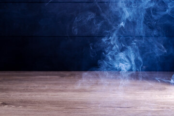 Wooden floor in night atmosphere, dark background and fog, light reflection on the floor, suitable for creating background images.