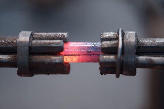 Hot Metal Being Shaped in the Forge with Red Glow Creating Beautiful Patterns in Steel Rod for Blacksmithing Artistry