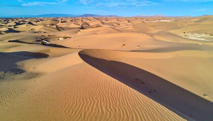 Aerial View of Beige Sand Dunes with Long Shadows