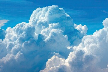 Fluffy cumulus clouds fill a vibrant blue sky