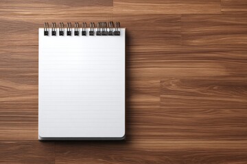 Blank spiral-bound notebook on a wooden surface