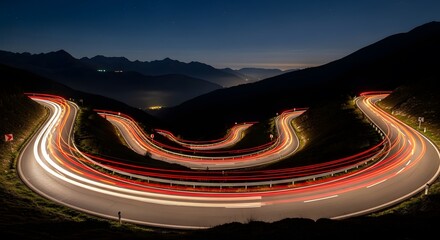 Conceptual journey with flowing light trails on a serpentine mountain road at night