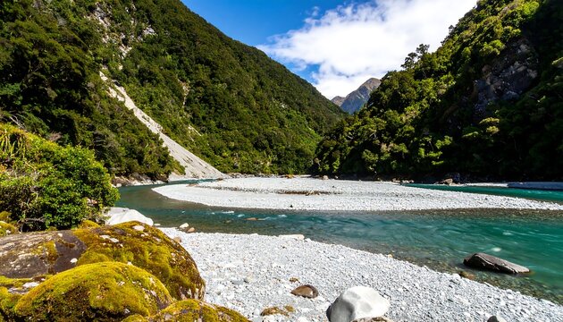 Lush river valley with light colored stones