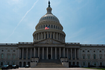 Fototapeta premium Washington DC Capitol. Congress on Capitol Hill. American flag over Capitol. Historic USA architecture. United States government Capitol landmark. Senate and House in Washington.