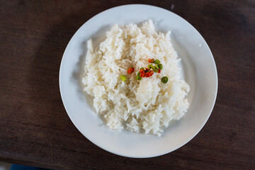 Steamed rice sprinkled with a little pickled chili on top