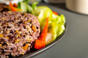 Colorful Mixed Grain Rice Served with Fresh Vegetables on a Plate