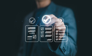 Businessman selecting checklist icon with digital interface, concept of project management, task completion, quality assurance, business success, productivity, and workflow efficiency.