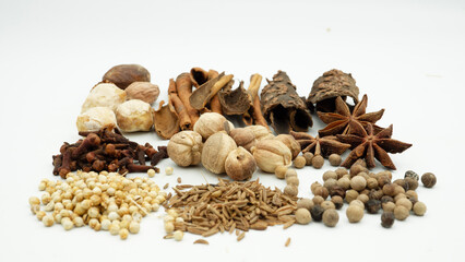 A vibrant array of spices, such as cloves, cinnamon, and nutmeg, are laid out, highlighting Indonesia's historical role in the spice trade and its rich flavors.