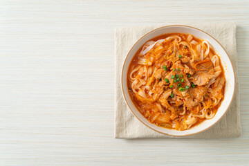 Korean udon ramen noodles with pork in kimchi soup