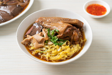 egg noodles with stewed and braised duck in brown soup
