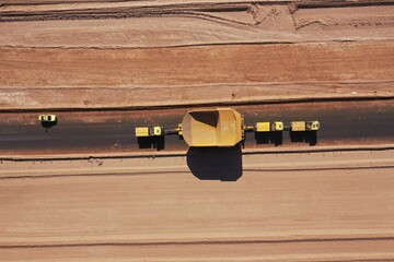 Heavy transport convoy moving a mining haul truck through desert highways in Chile