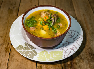 bowl with beef and chicken cross soup