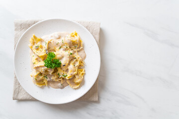 tortellini pasta with mushroom cream sauce and cheese