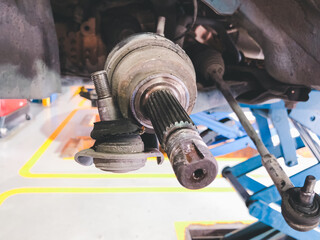 Ball joint and suspension of vehicle are broken, Maintenance car concept.