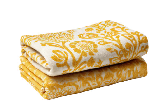 Folded, patterned blankets.  Two cream-colored blankets, stacked, featuring a repeating, muted yellow floral damask design