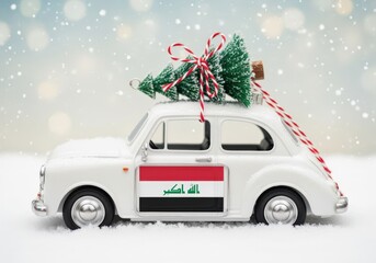 Miniature car with Christmas tree driving through snow