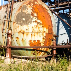 Rusted, large, industrial storage tank