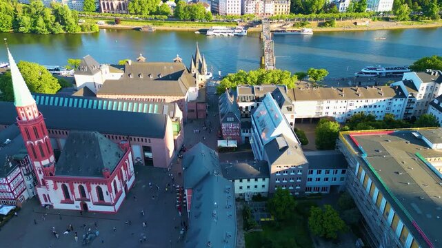 4K Drone Video of the Beautiful Churches and Buildings near the Eiserner Steg Iron Footbridge on the Main River in Downtown Frankfurt, Germany