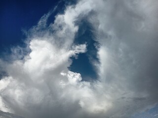 Obraz premium White and Gray Clouds Against Clear Blue Sky