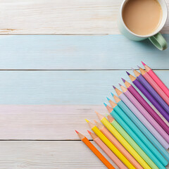 Obraz premium Colorful pencils with coffee cup on wooden desk background