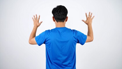 Fototapeta premium Asian man wearing blue tshirt over isolated white background and counting number with fingers. Rear view. Detailed high quality image. 
