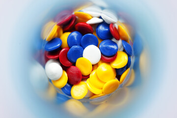 Colorful Round Discs in a Container from an Overhead Perspective