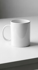 Obraz premium Minimalist white ceramic mug on a clean white surface ready to mockup