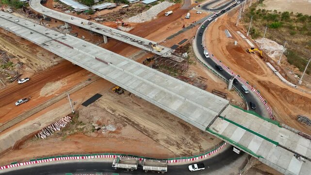 Aerial view drone footage of bridge construction being made across the intersection