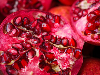 A close up of several pomegranates cut open to reveal their rich red seeds a vibrant and healthy display of antioxidant rich fruit