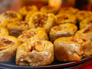 A display of kalburabasti a traditional Turkish pastry soaked in syrup and topped with a walnut a sweet and delicious homemade dessert