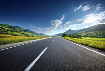 Naklejka premium A long asphalt road stretches toward distant green hills under a blue sky dotted with fluffy white clouds and sunshine