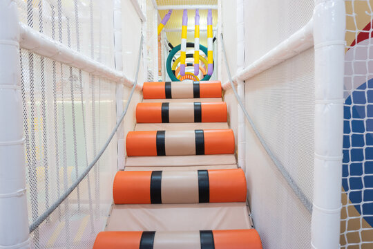 Colorful padded stairs in indoor playground